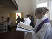 The Rev. Jessie Smith sings a hymn during a Sunday service in December at St. Anne&#039;s Episcopal Church in Washougal.