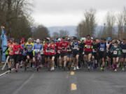 Racers take off from the starting line as they take part in the Vancouver Lake half-marathon in Vancouver Sunday Febuary 26, 2017.