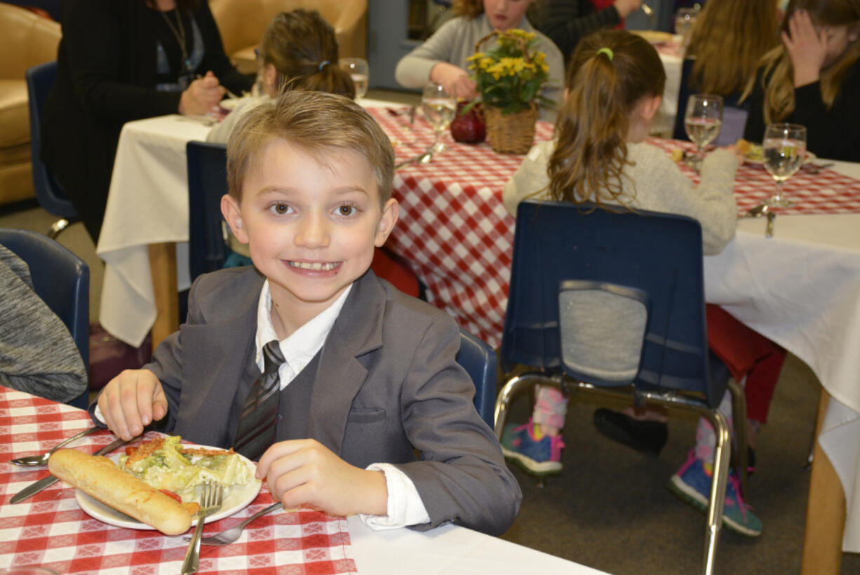 Washougal: Gause Elementary School student Kuryn Morris was part of a fine dining lunch, where students enjoyed a four-course meal while practicing etiquette skills.