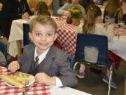 Washougal: Gause Elementary School student Kuryn Morris was part of a fine dining lunch, where students enjoyed a four-course meal while practicing etiquette skills.