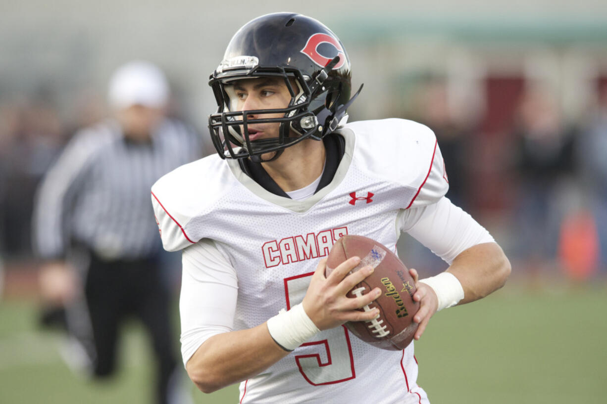 Camas quarterback Reilly Hennessey carries the ball against Eastlake at Eastlake High School, Saturday, November 23, 2013. Camas won 47-28.