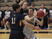 Clark College basketball's Jordan Berni, right.