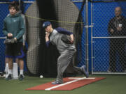 Jaxon Mills, 15, of Skyview High School, center, practices baseball at Advanced Skills Baseball in Vancouver on Monday. The business has opened its doors in the former Oxford Athletic Club.