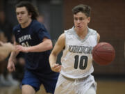 Union&#039;s Zach Reznick (10) keeps his concentration as he leads a fast break in the first quarter against Olympia at Union High School on Thursday.