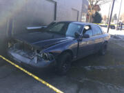 Photos by Emily Gillespie/The Columbian
Police said this dark-colored sedan was the vehicle driven by a suspect who fled from officers Saturday morning. An officer fired at the vehicle before the sedan crashed into another vehicle and a building several blocks away. The suspect, who was injured, fled on foot but was apprehended at 15th and C Streets.