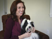 Lee Whittier pets her show dog, 18-month-old Tibetan terrier Oliver, at her home in Vancouver on Feb. 3. Whittier will judge at the 141st annual Westminster Kennel Club Dog Show in New York.