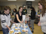 Washougal: Washougal High School culinary students Braiden Williams, left, and Jolene Porter serve Melissa Tauialo during the school&#039;s Food Truck Face Off.