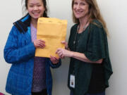 East Vancouver: Shahala Middle School student Ashley Lin, left, and Peggy Carlson, Evergreen Public Schools&#039; Students in Transition liaison, after Lin raised $752 for the program with a pancake breakfast.