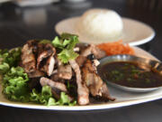 A plate of BBQ pork is seen at Thai Time on Northeast 49th Street in Vancouver.