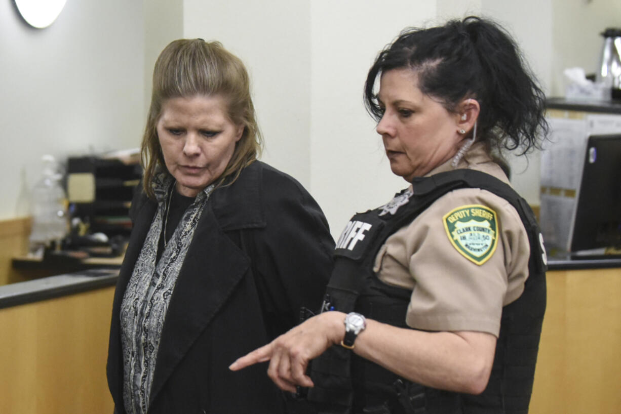 Shaun Johnson is escorted out of the courtroom Monday afternoon at the Clark County Courthouse, after being sentenced to 36 months in prison.