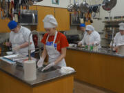 Woodland: Woodland High School SkillsUSA team members Deja Peterson, from left, Carinda Washburn, Brooke Schimmel, Daphne Mendoza and Katelynn-Paulson working on a culinary competition.