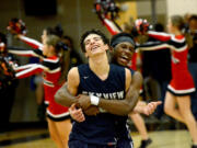 Skyview senior Levi Nickelson hugs teammate Alex Schumacher after Skyview beat Camas 45-44 at Camas High School on Wednesday, February 1, 2017. Schumacher won the game with a late three-pointer.