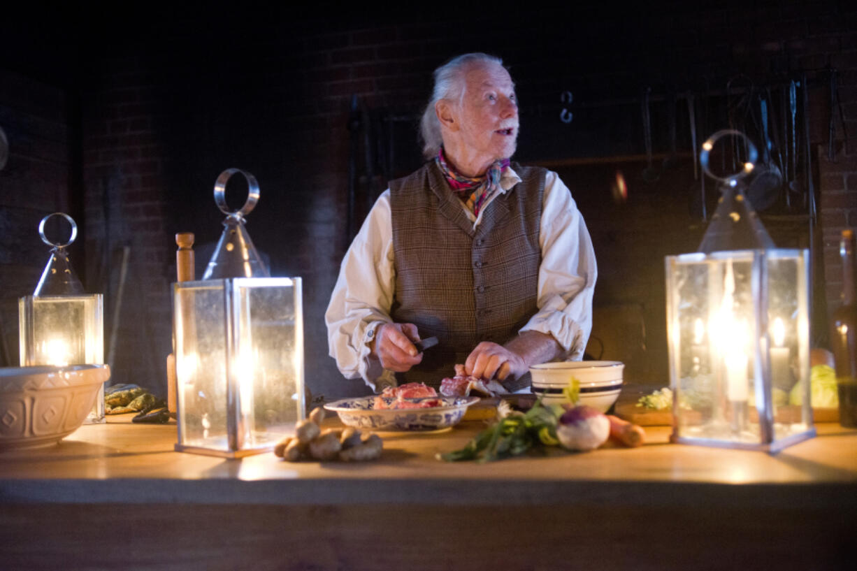 Bob Prinz looks up while slicing a piece of chicken in the kitchen at the Fort Vancouver National Historic Site on Tuesday, January 10. Prinz has been volunteering at Fort Vancouver for nearly 3 years as a re-enactor, demonstrating the techniques and ingredients that would have been used at the original fort in the 1800s.