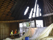 Crews with Right Manufacturing move a steel beam inside the First Congregational United Church of Christ in Hazel Dell.