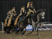 The BlackPearl Friesian Dance Troupe performs at the annual Washington State Horse Expo Saturday at the Clark County Event Center.