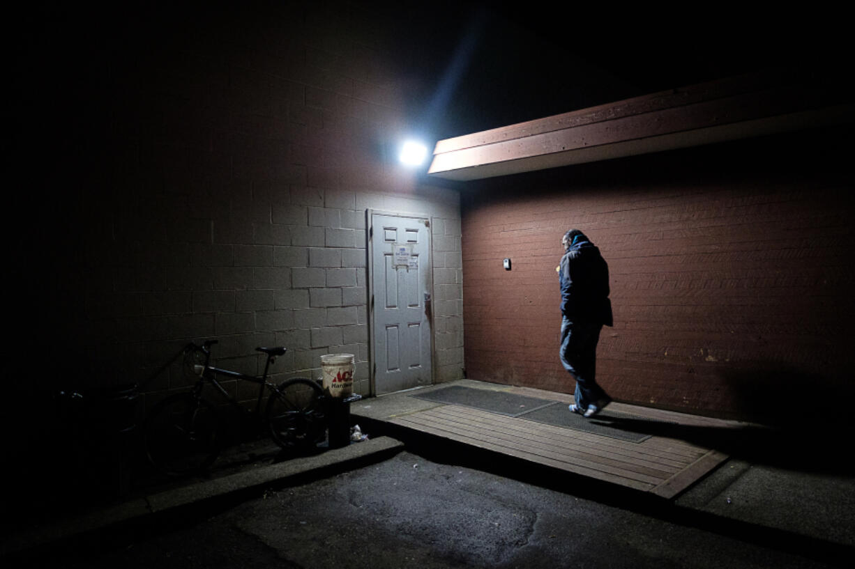 Ralph Austin, 56, walks into the Vancouver Friends of the Carpenter day center on Jan. 27. Austin lives at Share House, but regularly visits the center to talk with staff assistant Otha Commons.