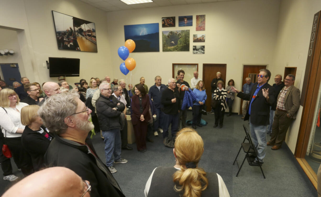 Editor Lou Brancaccio, right on the stepstool, regales about 250 guests with stories of his life in journalism at an open house to celebrate his retirement Saturday at The Columbian. Brancaccio&#039;s last day was Friday after 20 years with the paper, although he&#039;ll stay on as editor emeritus and contribute a monthly column.