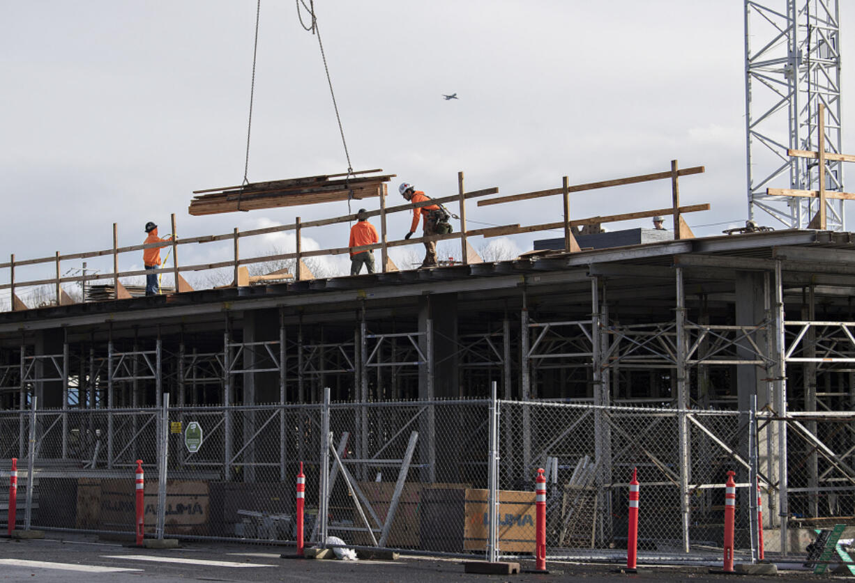 Construction continues on The Uptown, a 167-unit apartment complex in Vancouver. There is broad agreement that more housing is needed.