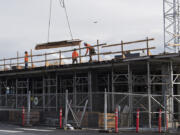 Construction continues on The Uptown, a 167-unit apartment complex in Vancouver. There is broad agreement that more housing is needed.