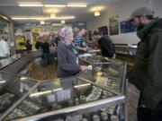 Budtender Cher Poff helps a customer at Main Street Marijuana in downtown Vancouver.