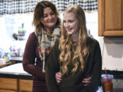 Amy Coles, left, shares a moment with her daughter, Kaylin, 13, in their home in Battle Ground. Kaylin was diagnosed with chronic kidney failure in May, and her family is searching for a living donor.