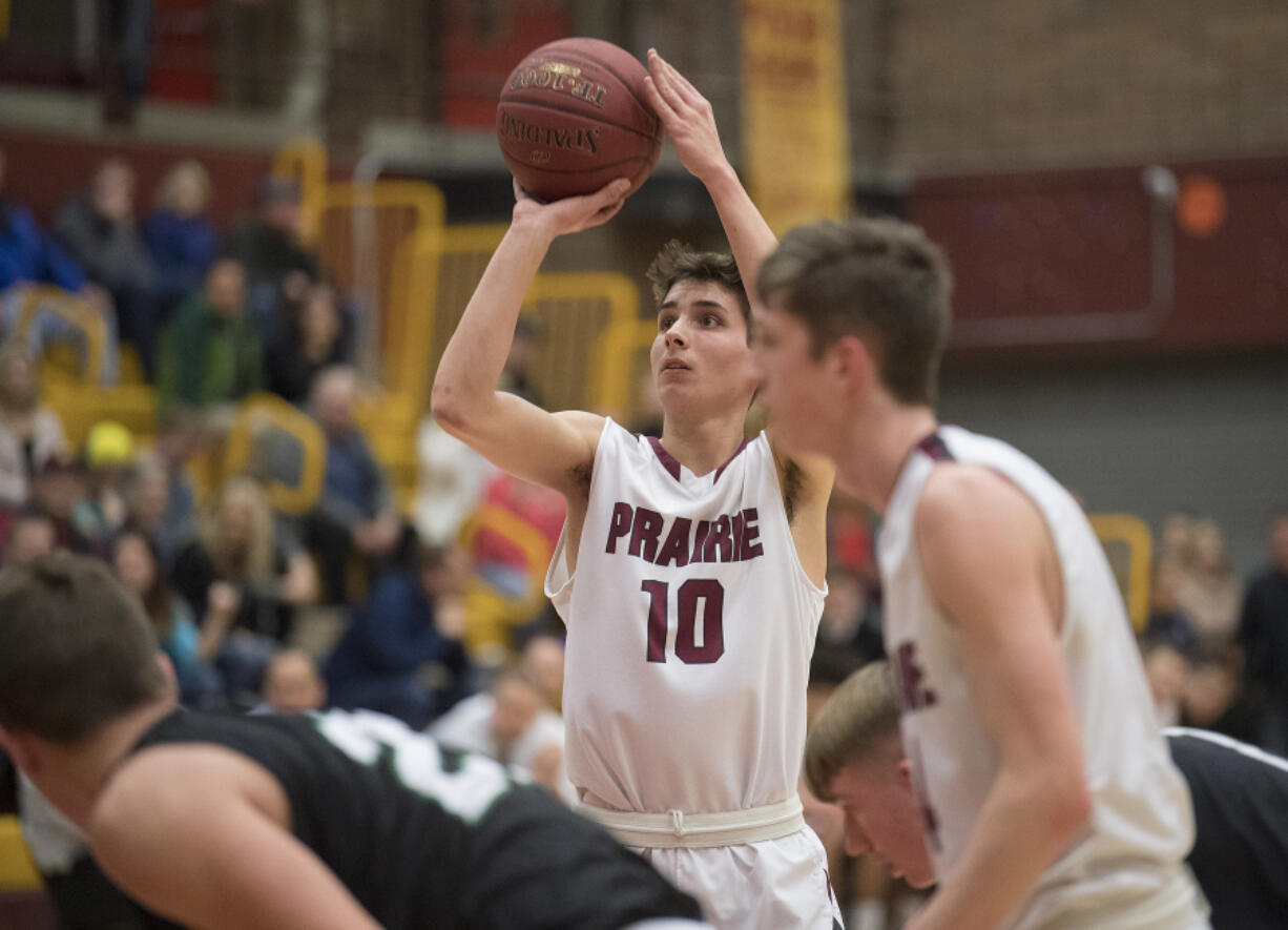 Prairie&#039;s Seth Hall (10) shoots a free throw in the first quarter against Peninsula at Prairie High School on Wednesday night, Feb. 8, 2017.