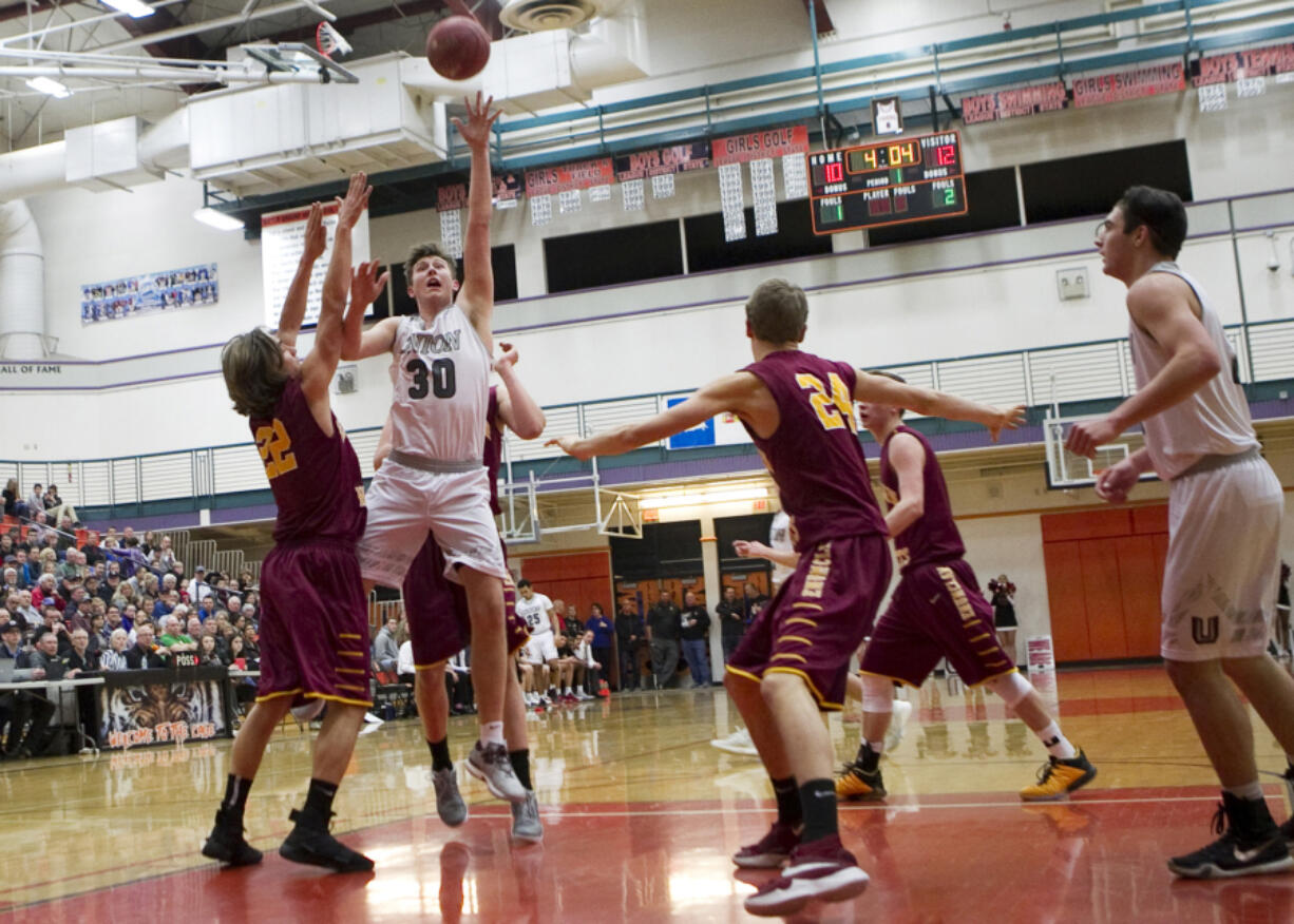 Union's Cameron Cranston (30) takes a shot in the key during the Titans' 75-50 win over Enumclaw in a 4A regional game on Saturday, Feb. 25, 2017, at Battle Ground. Cranston finished with 28 points.