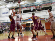 Union's Cameron Cranston (30) takes a shot in the key during the Titans' 75-50 win over Enumclaw in a 4A regional game on Saturday, Feb. 25, 2017, at Battle Ground. Cranston finished with 28 points.