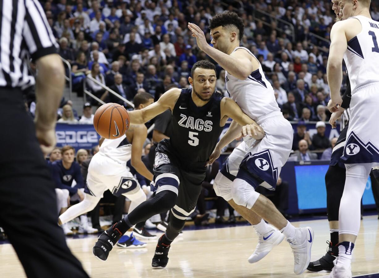 Gonzaga guard Nigel Williams-Goss (5) dribbles to the basket against BYU guard Elijah Bryant (3) in the first half during an NCAA college basketball game Thursday, Feb. 2, 2017, in Provo, Utah.