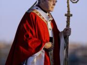 FILE - In this July 15, 2008, file photo, Cardinal George Pell walks onto the stage for the opening mass for World Youth Day in Sydney, Australia. Seven percent of priests in Australia's Catholic Church were accused of sexually abusing children over the past several decades, a lawyer said on Monday, Feb. 6, 2017. Cardinal Pell has previously testified before the commission about how church authorities responded to allegations of child sex abuse during his time in Australia.