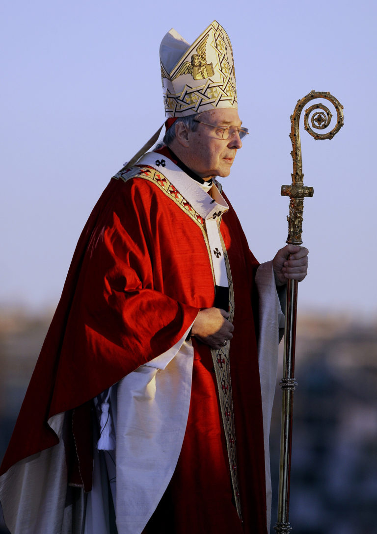 FILE - In this July 15, 2008, file photo, Cardinal George Pell walks onto the stage for the opening mass for World Youth Day in Sydney, Australia. Seven percent of priests in Australia's Catholic Church were accused of sexually abusing children over the past several decades, a lawyer said on Monday, Feb. 6, 2017. Cardinal Pell has previously testified before the commission about how church authorities responded to allegations of child sex abuse during his time in Australia.