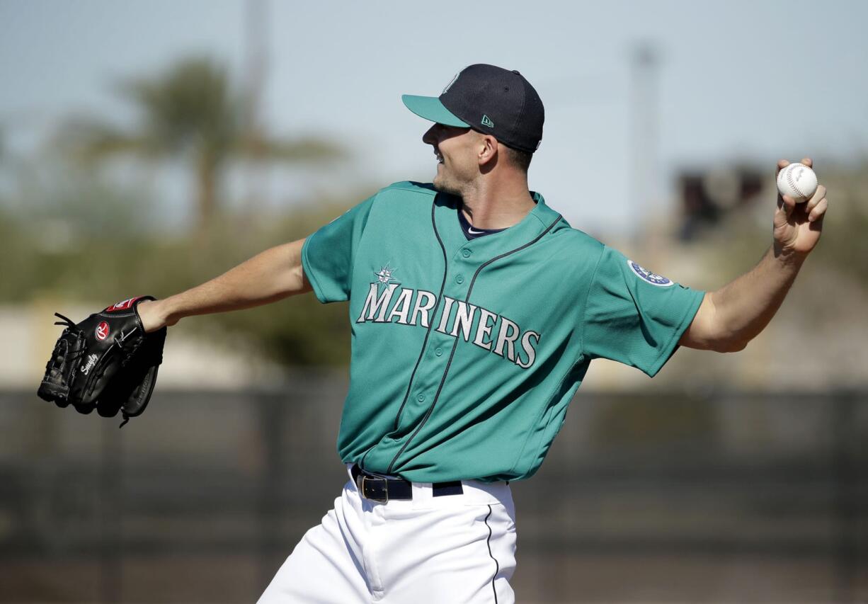 Seattle Mariners pitcher Drew Smyly participates in a drill during spring training baseball practice Wednesday, Feb. 15, 2017, in Peoria, Ariz.