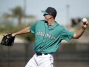 Seattle Mariners pitcher Drew Smyly participates in a drill during spring training baseball practice Wednesday, Feb. 15, 2017, in Peoria, Ariz.