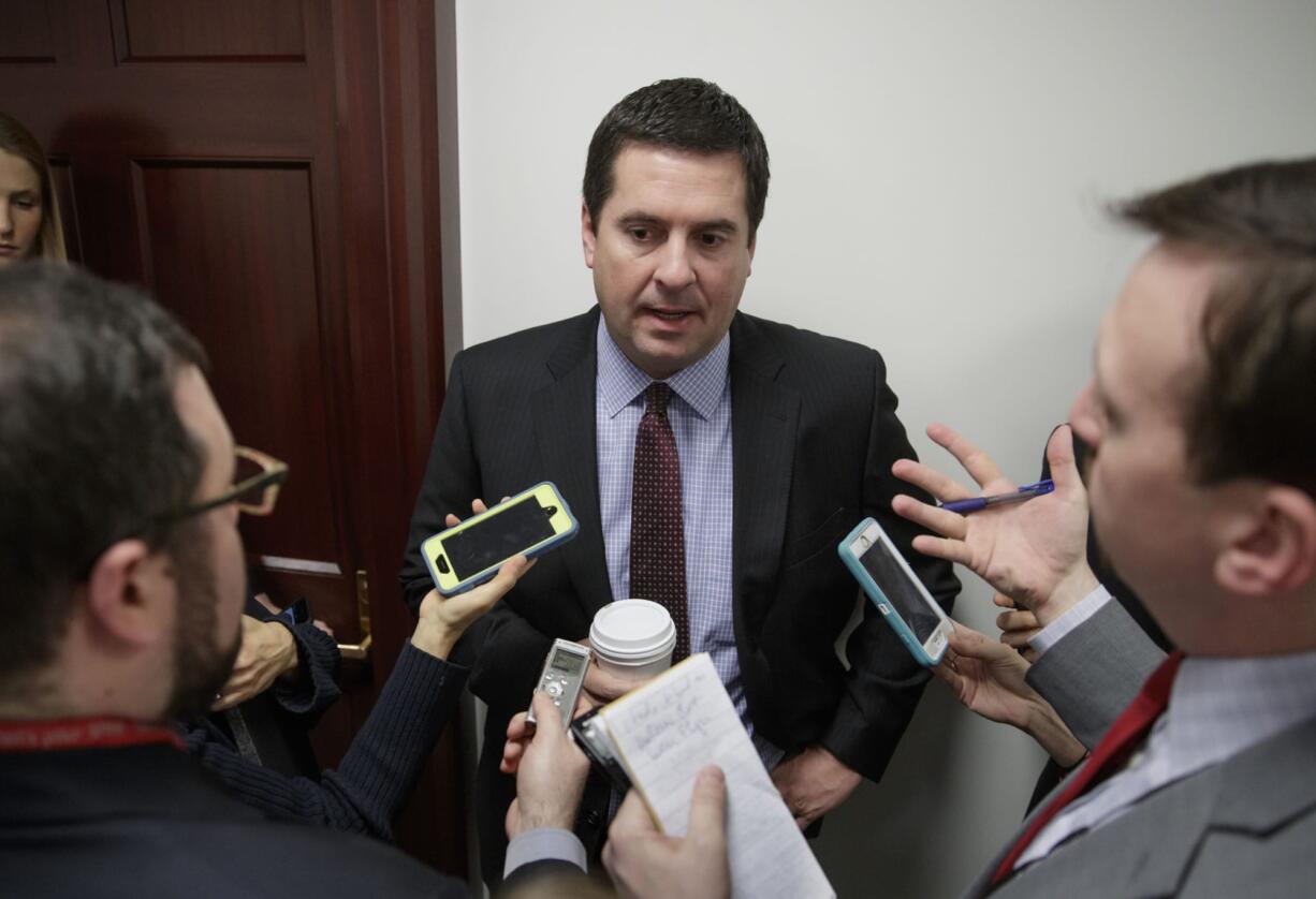 FILE - In this Feb. 14, 2017 file photo, House Intelligence Committee Chairman Rep. Devin Nunes, R-Calif., is questioned by reporters on Capitol Hill in Washington. Nunes said Monday, Feb. 27, 2017, Congress should not begin a McCarthy-style investigation based on news reports that a few Americans with ties to President Donald Trump had contacted Russians during the 2016 presidential campaign.  (AP Photo/J.