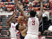 Arizona forward Allonzo Trier (35) tries to shoot between Washington State defenders Viont&#039;e Daniels (4) and Robert Franks (3) in the first half of an NCAA college basketball game, Thursday, Feb. 16, 2017, in Pullman, Wash.