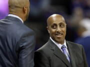 Washington coach Lorenzo Romar, right, greets a member of the Arizona State coaching staff before an NCAA college basketball game, Thursday, Feb. 16, 2017, in Seattle. (AP Photo/Ted S. Warren) (Ted S.