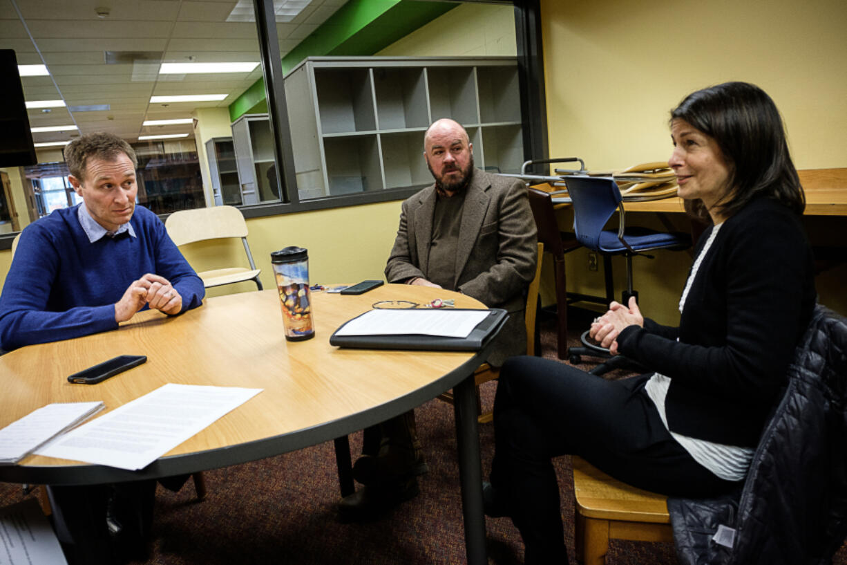 Elise Menashe, executive director of the Boys &amp; Girls Clubs of Southwest Washington, speaks with Matthew Butte, development director at the Children&#039;s Center, left, and Brian Willoughby, director of community benefit with Legacy Health, about the recent collaboration among the three organizations.