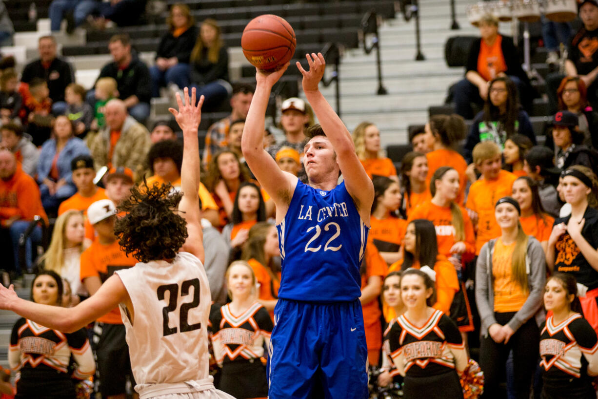 La Center's Matt Baher shoots over Zillah's Nate Whitaker during the first half of their Class 1A regional match-up at Davis High School in Yakima, Wash. on Saturday, Feb. 25, 2017.