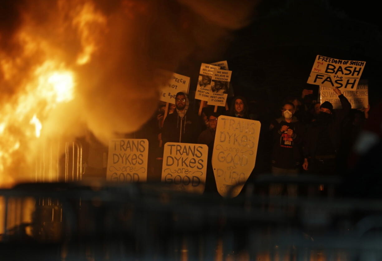 Protestors watch a fire on Sproul Plaza during a rally against the scheduled speaking appearance by Breitbart News editor Milo Yiannopoulos on the University of California at Berkeley campus on Wednesday in Berkeley, Calif. The event was cancelled due to size of the crowd and several fires being set.