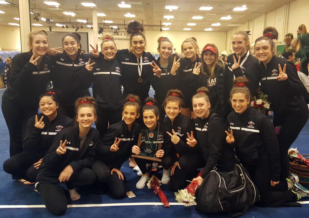 Members of the Camas gymnastics team pose after placing second at the WIAA Class 4A state championship at Tacoma on Friday, Feb. 17, 2017.