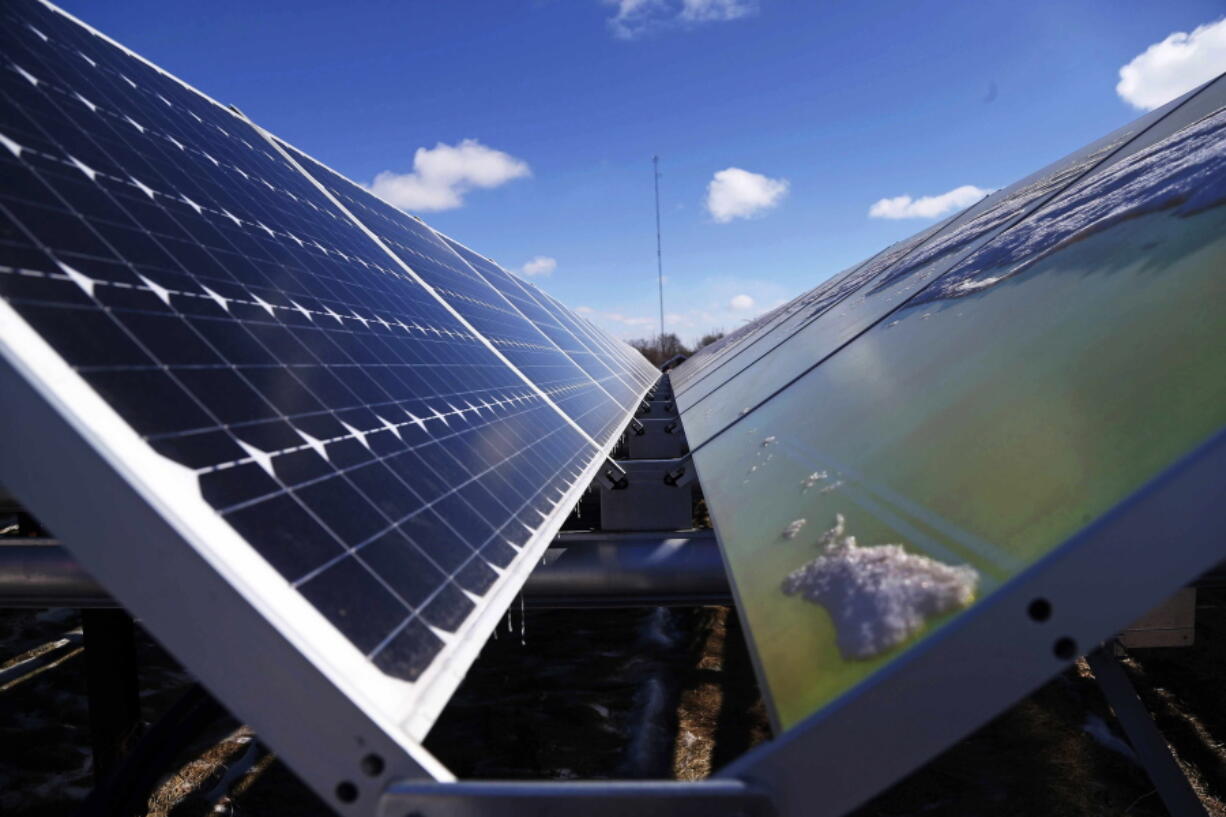 Solar panels harvest power in February 2015 at the Wright-Hennepin Cooperative Electric Association&#039;s community gardens in Rockford, Minn. Major electric utilities are moving into smaller-scale solar farming, a niche developed by local cooperatives and nonprofits.