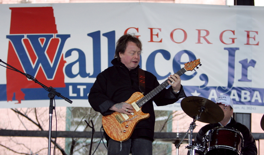 FILE - In this Feb. 18, 2006 file photo, Rick Derringer performs during a campaign rally kicking off George Wallace Jr&#039;s bid for the office of lieutenant governor in Montgomery, Ala.  Prosecutors say  Derringer carried a loaded gun in his carry-on bag on a Delta Air Lines flight from Cancun, Mexico, but was stopped after landing in Atlanta.  Derringer was charged with unlawfully entering an airport???s secure area Jan. 9, 2017. His representatives didn???t immediately return multiple calls and emails.