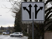 Icicles hang from a traffic sign along Southeast McGillivray Boulevard Friday morning.