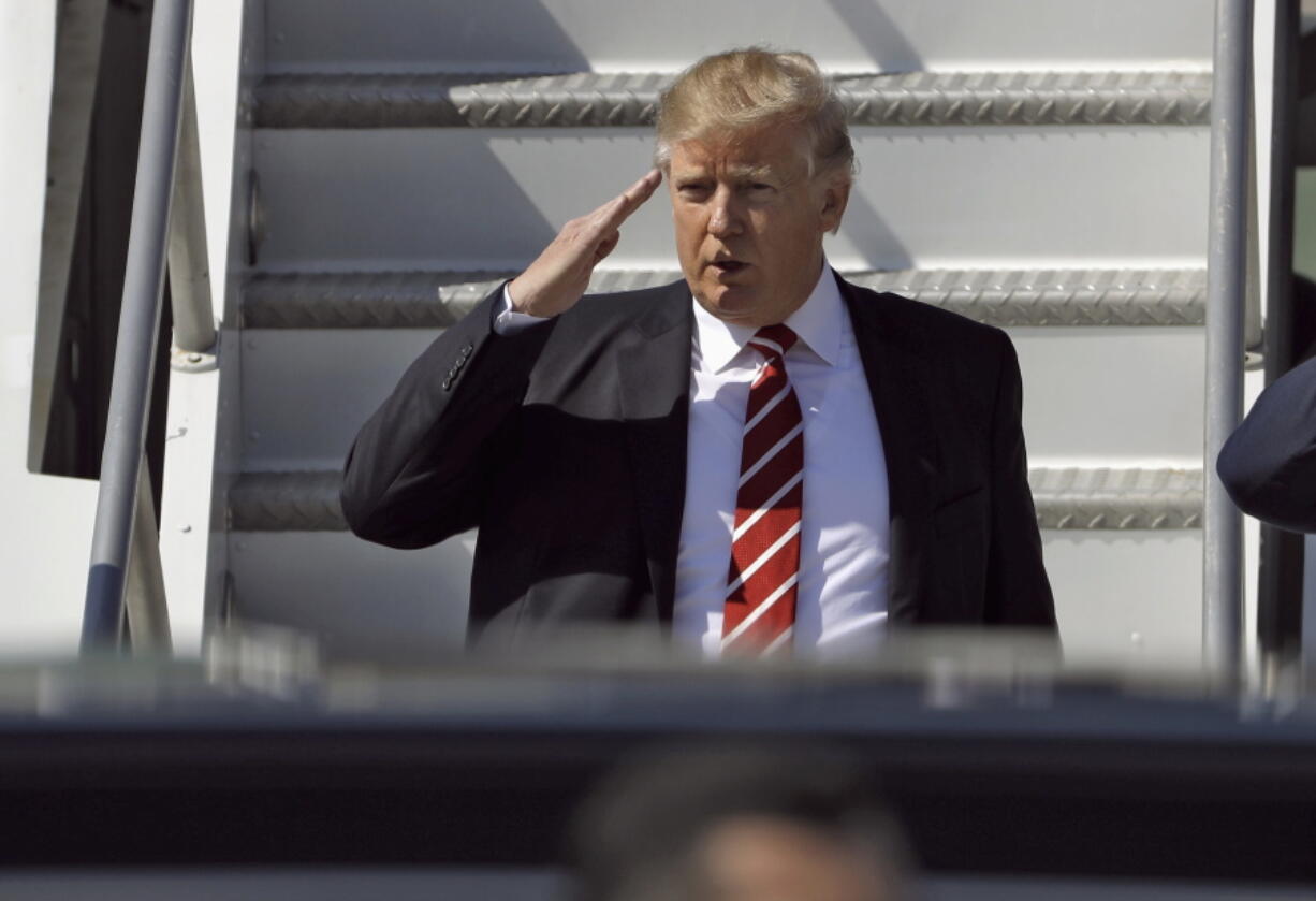 President Donald Trump steps off Air Force One on Monday at MacDill Air Force Base in Tampa, Fla.