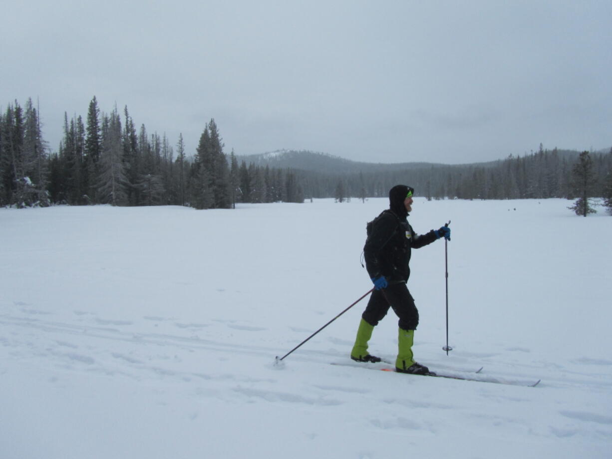 Ben Swinehart, of Bend, Ore., skis near Swampy Lakes, Ore. Escaping into winter and finding some solitude can be a challenge.