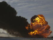 A fireball goes up at the site of an oil train derailment in Casselton, N.D., on Dec. 30, 2013. The National Transportation Safety Board is set to release the cause of the 2013 oil train derailment in eastern North Dakota. The accident happened when a train carrying soybeans derailed in front of an oil tanker train near the small town of Casselton. It caused a series of explosions and the evacuation of about 1,400 residents, but no one was hurt.