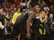 Oregon forward Jordan Bell reacts after scoring against Stanford during the second half of an NCAA college basketball game in Stanford, Calif., Saturday, Feb. 25, 2017. Oregon won 75-73.