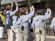 Animal keepers wave goodbye to Bao Bao, the beloved 3-year-old panda, Tuesday at the National Zoo. (J.