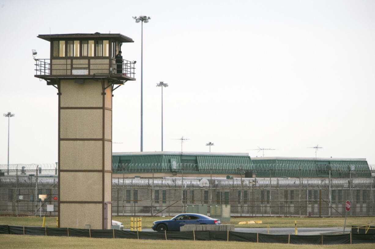 A prison guard stands at one of the towers at  James T. Vaughn Correctional Center. All Delaware prisons went on lockdown Wednesday, Feb. 1, 2017,  due to a hostage situation unfolding at the James T. Vaughn Correctional Center in Smyrna. Geoffrey Klopp, president of the Correctional Officers Association of Delaware, said he had been told by the Department of Correction commissioner that prison guards had been taken hostage.