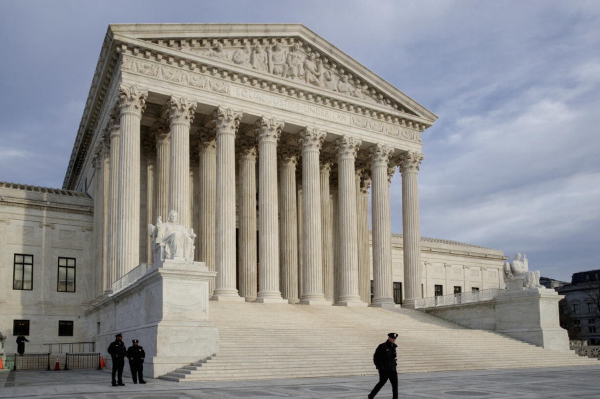 The Supreme Court is seen at day&#039;s end in Washington.  (AP Photo/J.